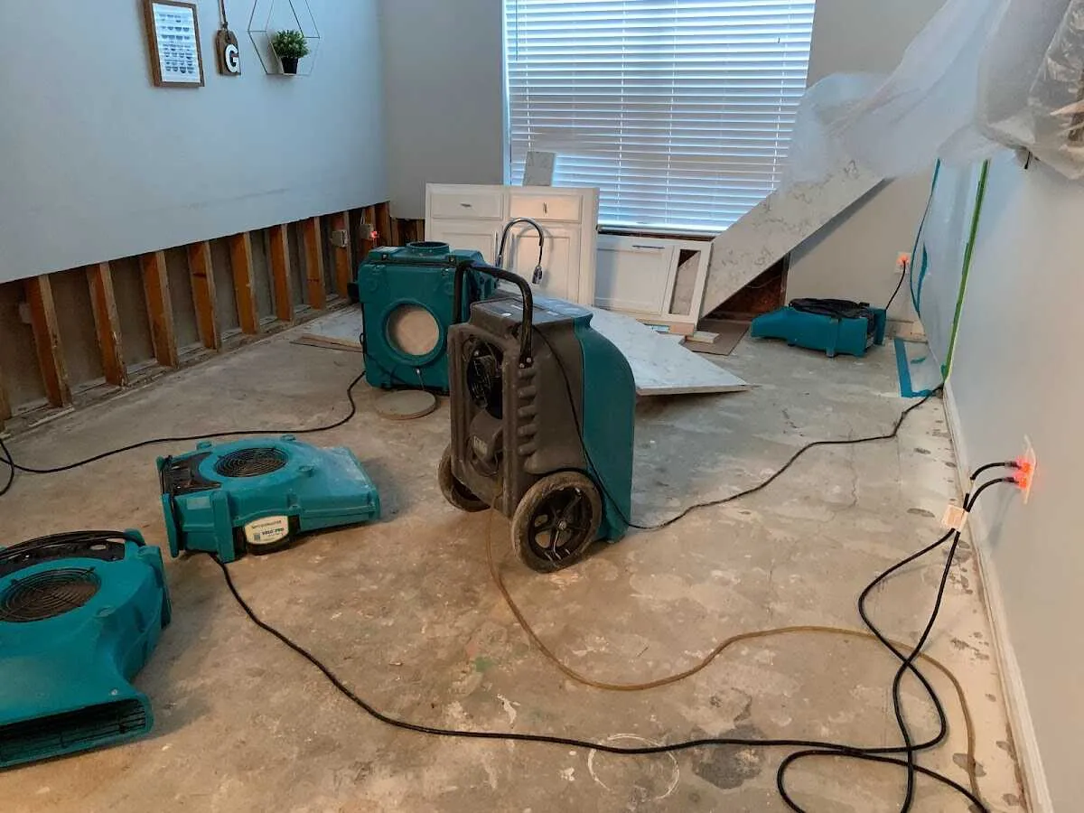 Dehumidifier in flood-cut room for Water Damage Restoration in Ghent